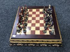 A nautical chess set on gilt base CONDITION REPORT: The set is complete.