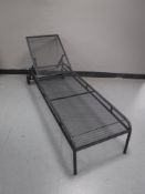 A metal adjustable garden lounger