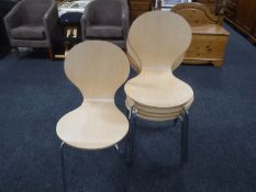 Five Ikea stacking chairs