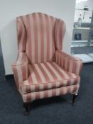 An early 20th century wing back armchair