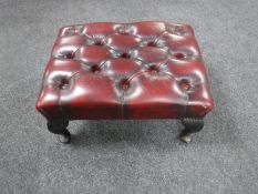 A Chesterfield oxblood button leather footstool