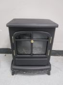 An electric fire in the form of a stove
