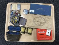 A tray of ivory mounted opera glasses, Ronson lighter, playing cards,
