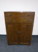 A 20th century oak linen cupboard