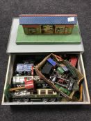 A Hornby tin plate model railway station platform, together with a tin plate level crossing,