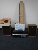 A Sanyo 4 channel stereo system with speakers and a box Aldis projector,