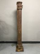 A 19th century cast iron horse post with hitch