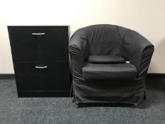 A armchair with loose cover and a black ash shoe cupboard