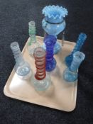 A tray of antique spiral twist glass bottles together with a part Victorian lustre