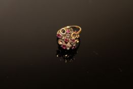 A 9ct gold ruby cluster ring, size L CONDITION REPORT: 4.8g.