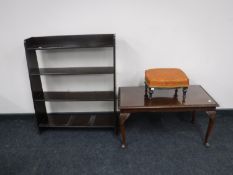 An mahogany glass topped coffee table,