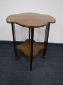 An early 20th century inlaid shaped occasional table