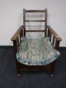 An early 20th century oak adjustable armchair