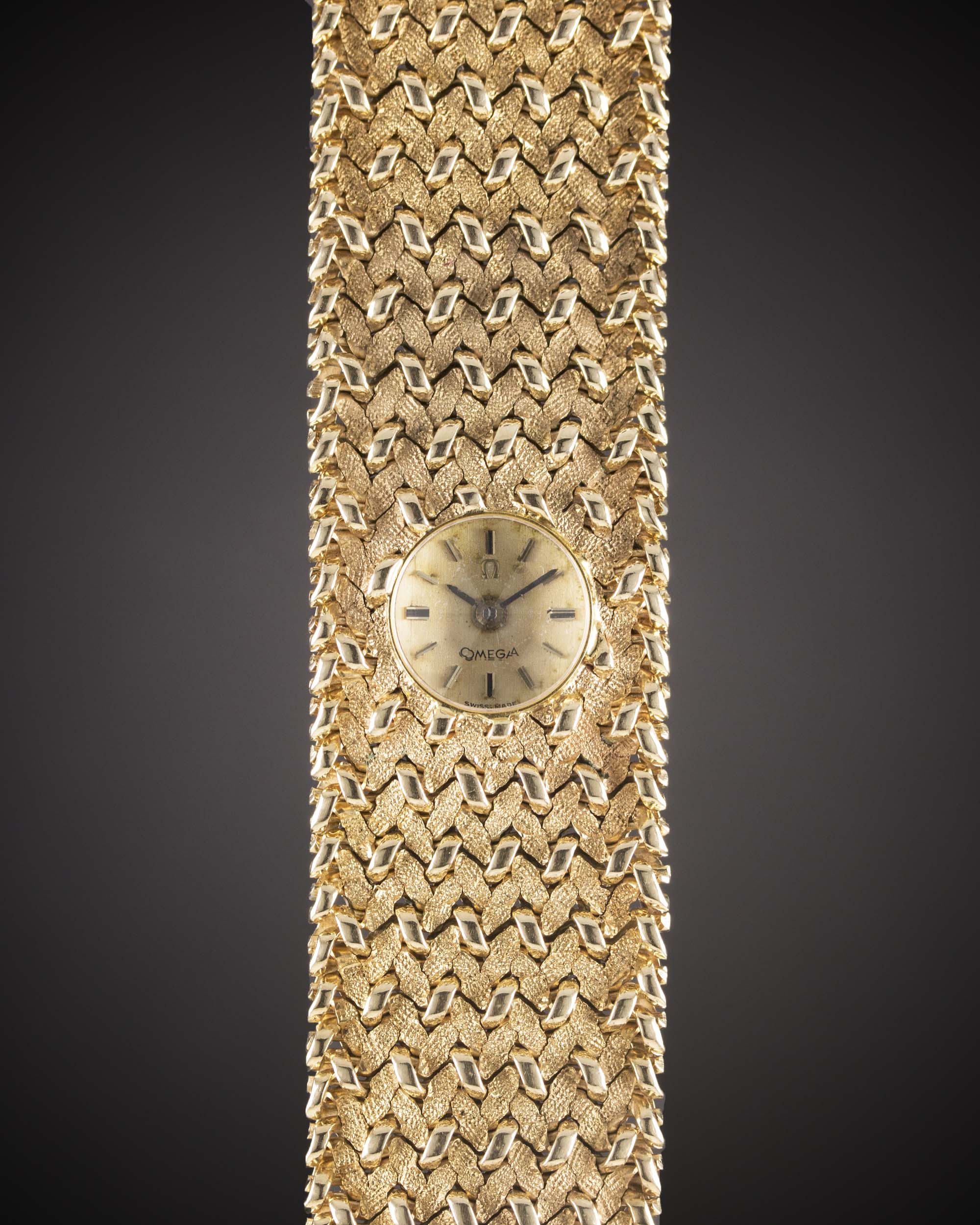 A LADIES 9CT SOLID GOLD OMEGA BRACELET WATCH CIRCA 1960s Movement: Manual back-wind, signed Omega,