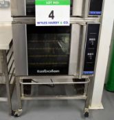 A BLUE SEAL Turbo Fan Model E31 D4 Stainless Steel Electric Oven on Castor mounted Stand