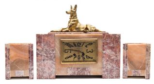 A marble and bronze Art Deco clock garniture: the eight-day duration French movement striking the