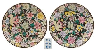 A pair of Chinese famille noire millefleur dishes: each painted with full blown flowers and foliage