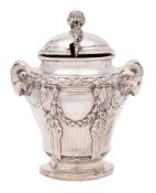A French silver mustard pot: with domed hinged lid enclosing a clear glass liner,