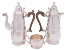 A George V matched silver three-piece coffee service: maker Mappin & Webb, London,