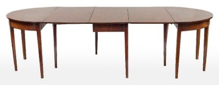 A George III mahogany D-end dining table in three parts:,