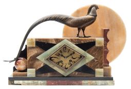 A marble and bronze Art Deco mantel clock: the eight-day duration French movement striking the