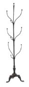 A wrought iron 'tree' hat stand:, with curved branches and stylised leaf decoration,