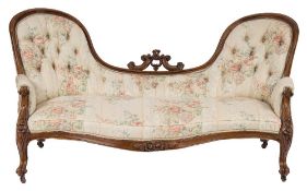 A Victorian carved walnut settee:,