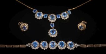 A suite of 'Ceylon' blue and white sapphire mounted jewellery: with necklace,