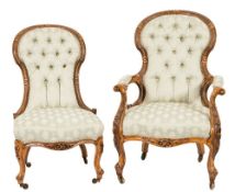 A Gentleman's Victorian carved walnut open armchair:,
