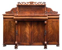 A Victorian carved mahogany breakfront chiffonier:,