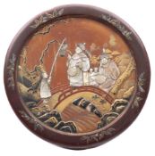 A Japanese lacquered, mother of pearl and ivory inlaid box: of circular outline,