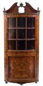A late 18th/early 19th Century Dutch walnut and floral marquetry bow-fronted standing corner