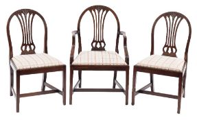 A set of eight mahogany dining chairs in the Hepplewhite taste:,
