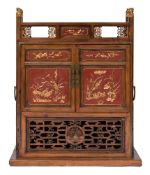 A Chinese wood, red lacquer and gilt decorated brass mounted floor cabinet:,