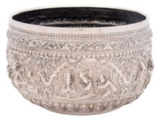 A Burmese silver rice bowl: with embossed decoration depicting scenes from a king's palace with