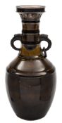 A Chinese silver mounted monochrome vase: of ribbed baluster form with mythical beast loose ring