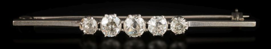 A graduated diamond five-stone bar brooch: with round old,
