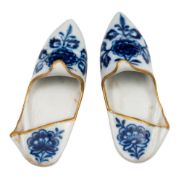 A pair of Meissen porcelain models of Persian-style slippers: decorated in underglaze blue, green,