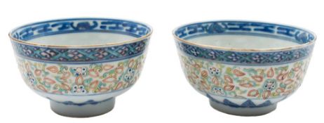 A pair of Chinese rice bowls: painted in underglaze blue, iron red,