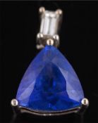 A trillion-cut tanzanite and baguette-cut diamond two-stone pendant: the trillion-cut tanzanite