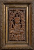 A continental cast plaster religious panel: probably 18th century depicting a central seated figure