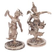 A pair of Burmese silver novelty menu or place name holders: modelled in the form of dancers in