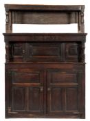An 18th Century oak tridarn:, with an open and slatted superstructure on turned supports,