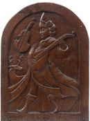 A carved oak domed panel: depicting Orpheus playing a lute, carved in low relief, 46.5cm x 34cm.