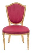 An early 19th Century carved giltwood salon chair in the Hepplewhite taste:,