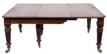 A Victorian mahogany extending dining table:, with a telescopic action,