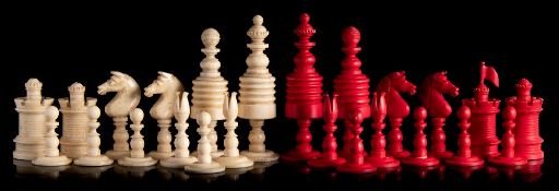 A 19th century Indian ivory Barleycorn style pattern chess set: one side stained red the other side