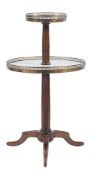 A French beechwood, white marble and brass galleried circular two tier graduated dumb waiter:,