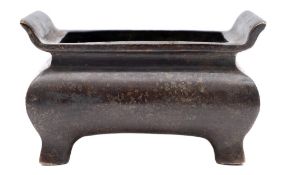 A Chinese bronze censer: of compressed rectangular shape with flared rim, six-character Xuande mark,