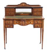 A lady's Edwardian rosewood and marquetry writing table:, of bowed breakfront outline,